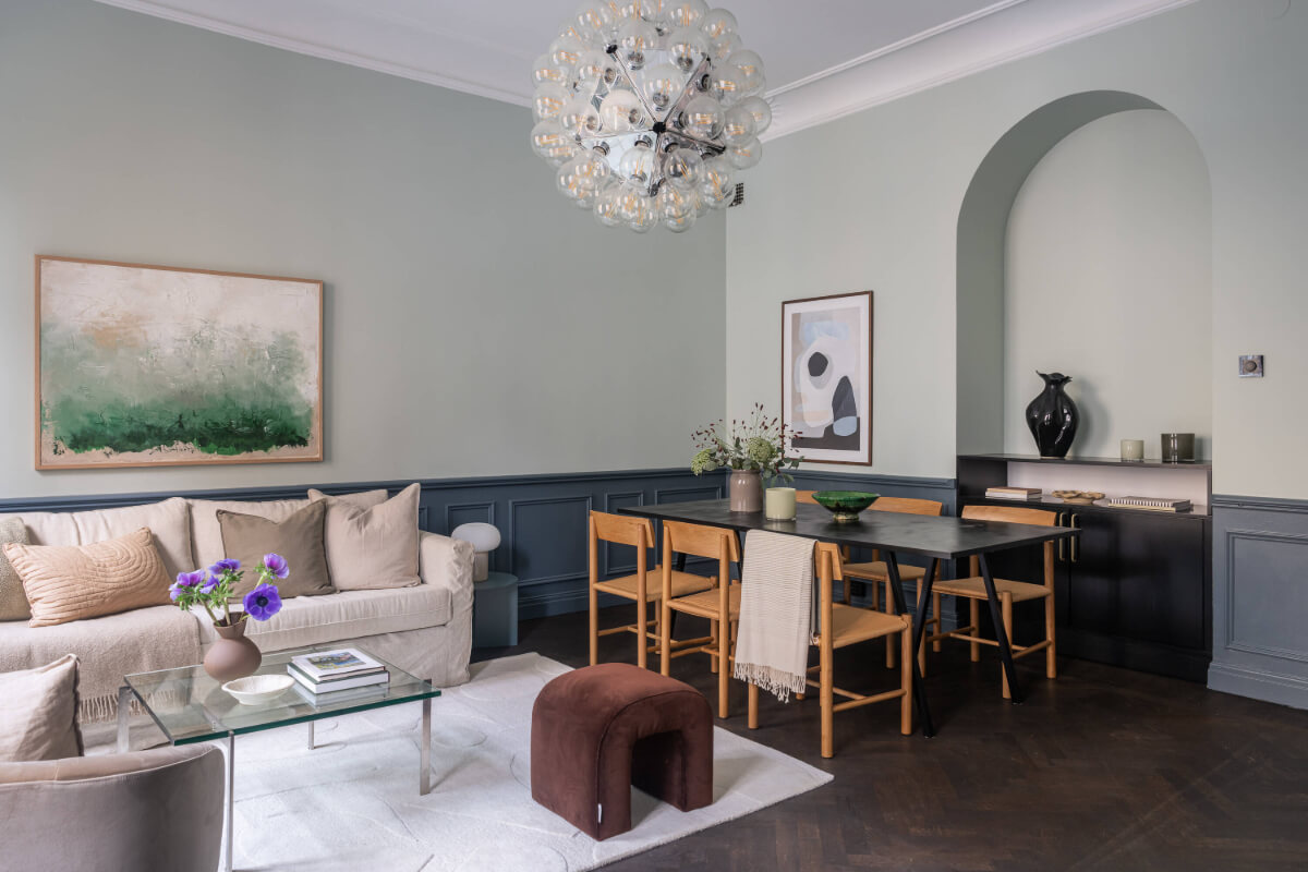 A Moody Color Palette in a Stylish One-Bedroom Apartment in Stockholm 5 stylish scandi living room with wooden dining table