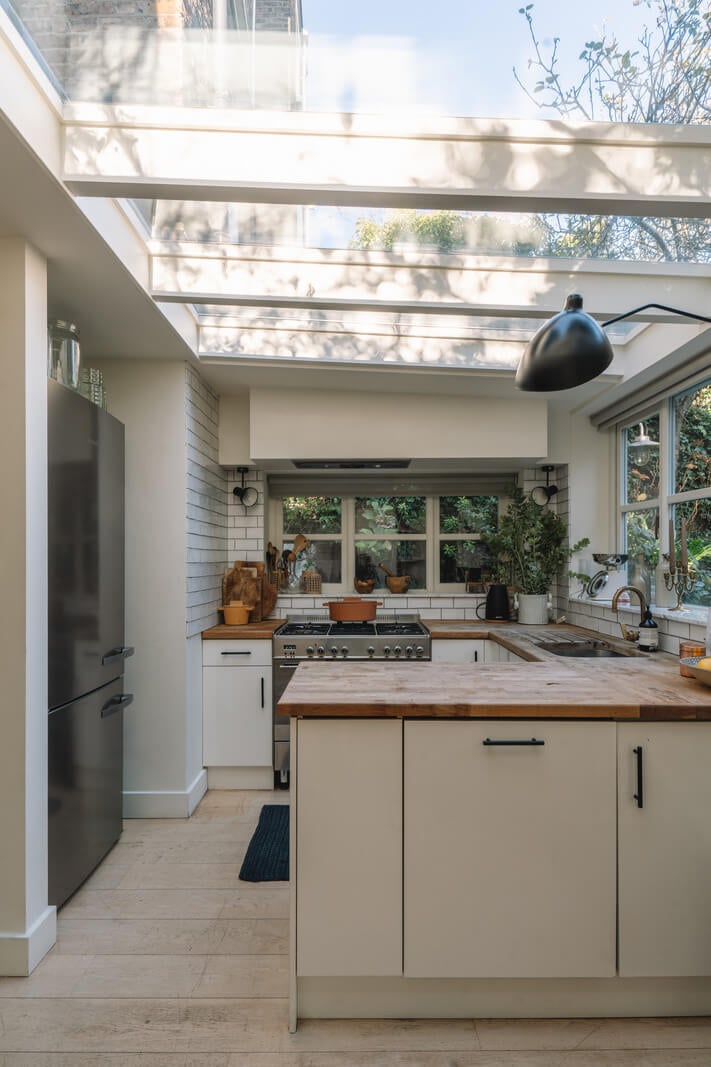 A Charming Garden Apartment in North Kensington 9 plant filled garden with bench
