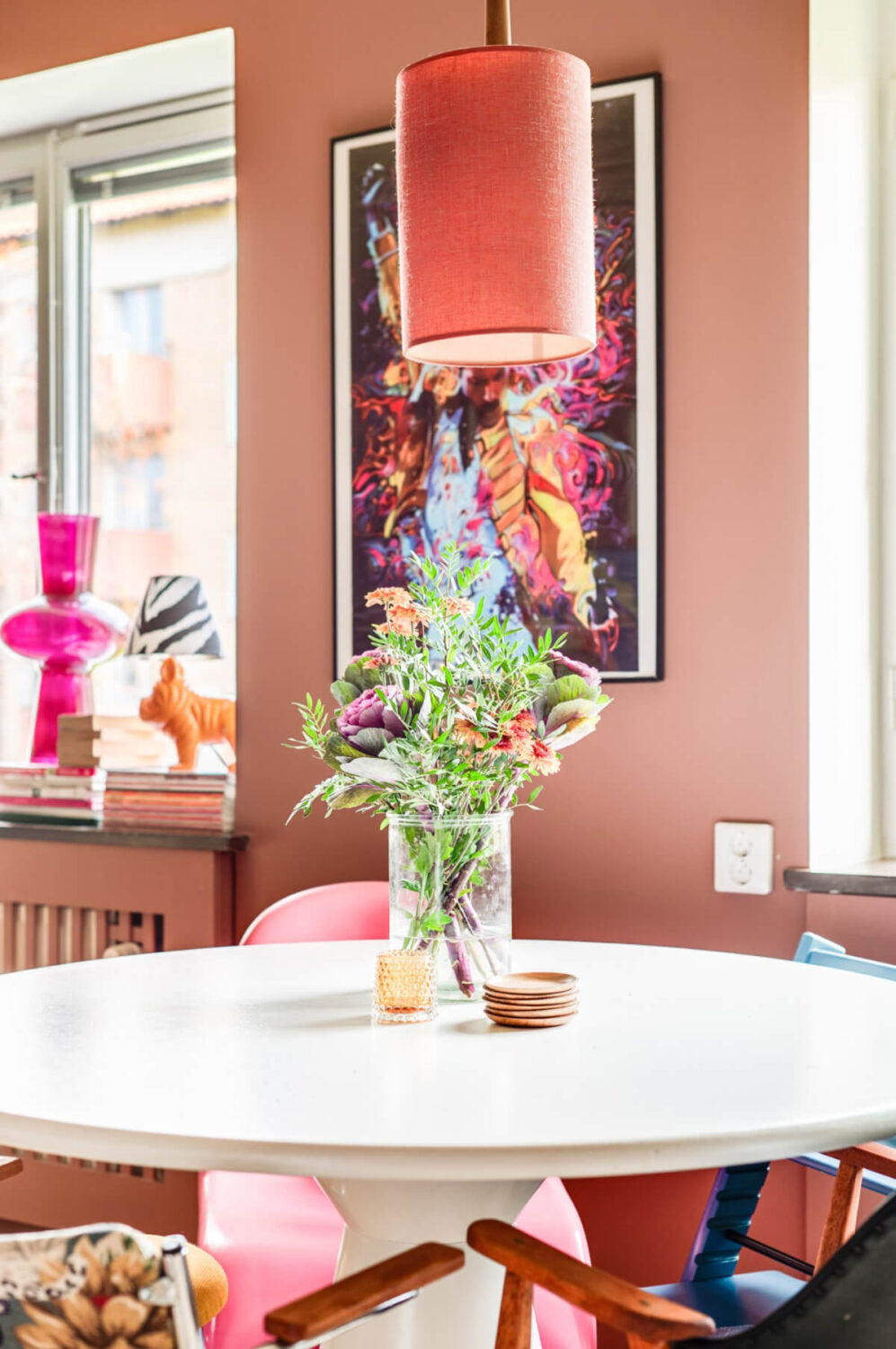A Vibrant, Colorful Midcentury Apartment in Malmö 7 white round kitchen table in colorful room