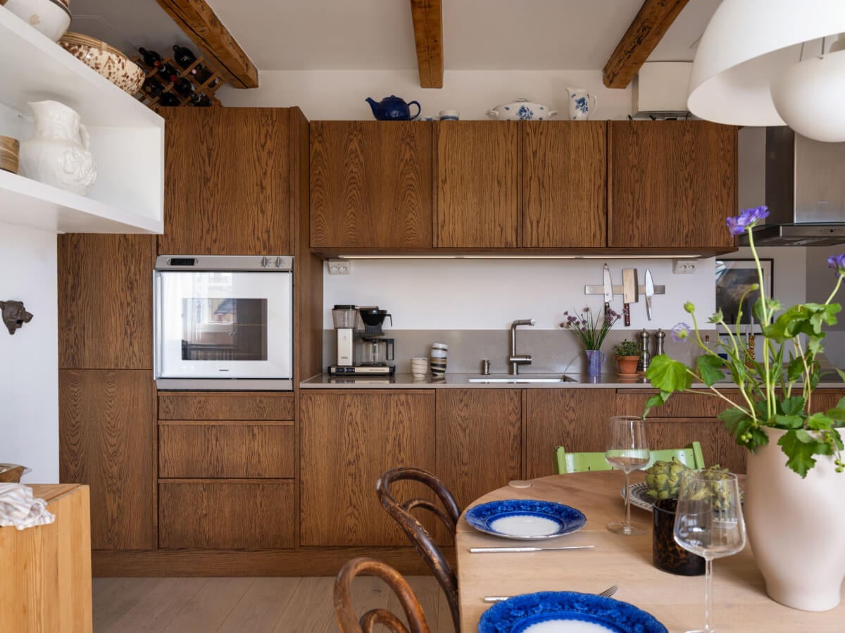 A Charming Light-Filled Attic Apartment with a Dark Oak Kitchen 6 wood kitchen in stockholm attic apartment