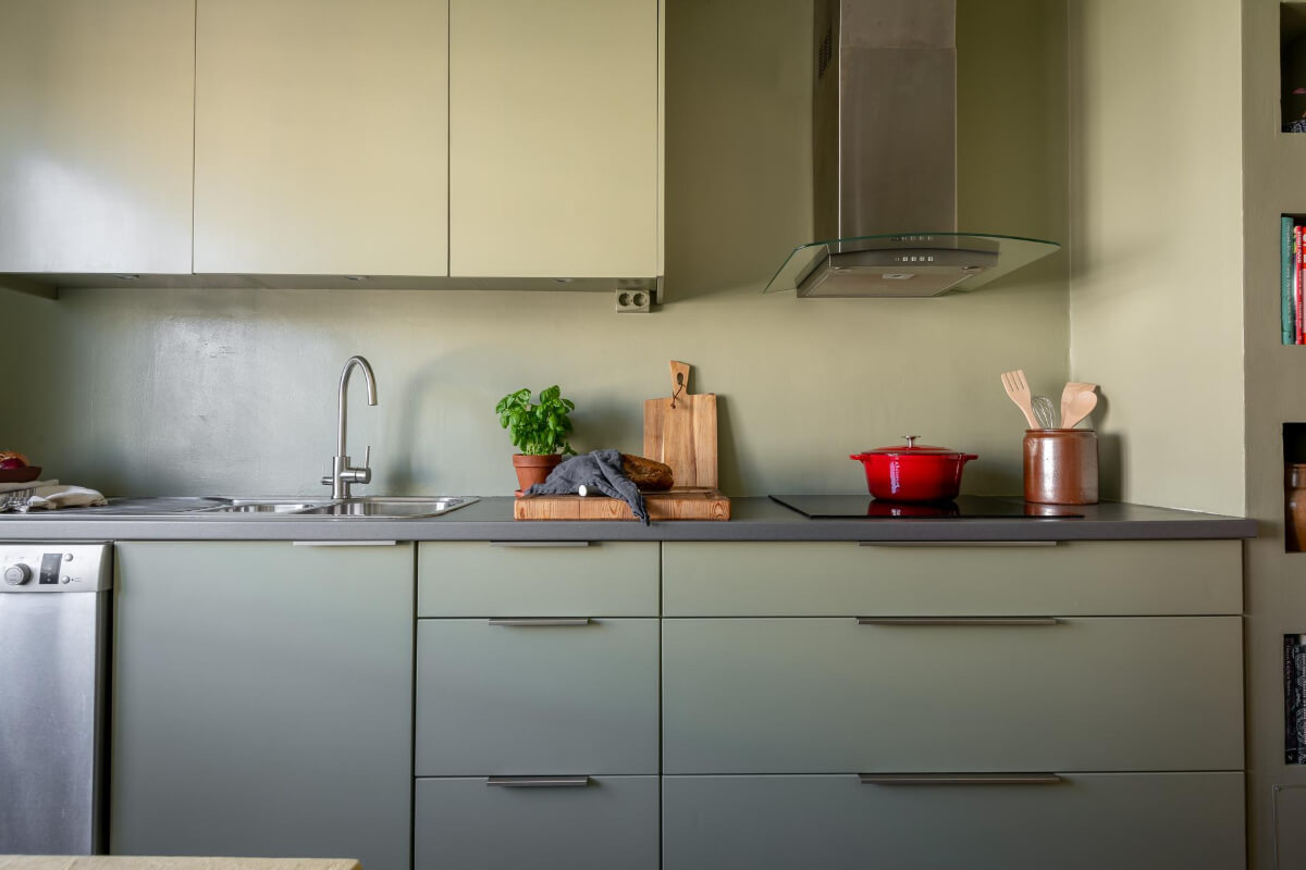 Light Rooms and a Moody Color Palette in a 1930s Apartment 17 all-green kitchen