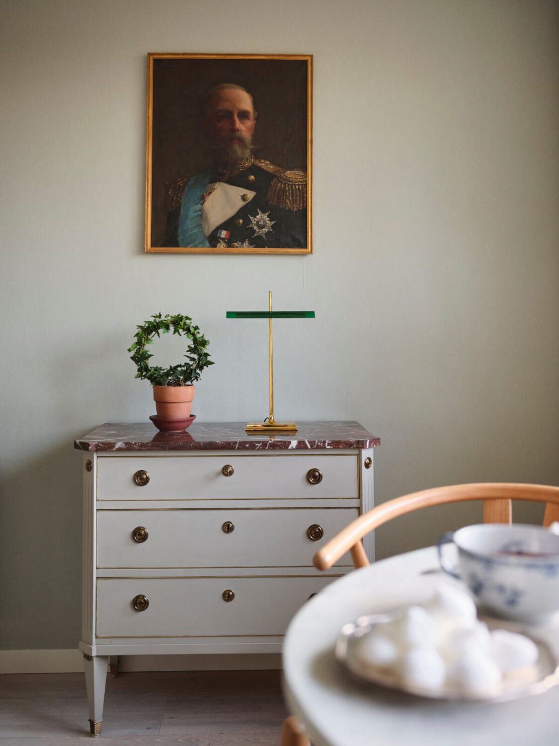 A Small Stockholm Apartment with a Tiny Green Bedroom 10 antique pieces