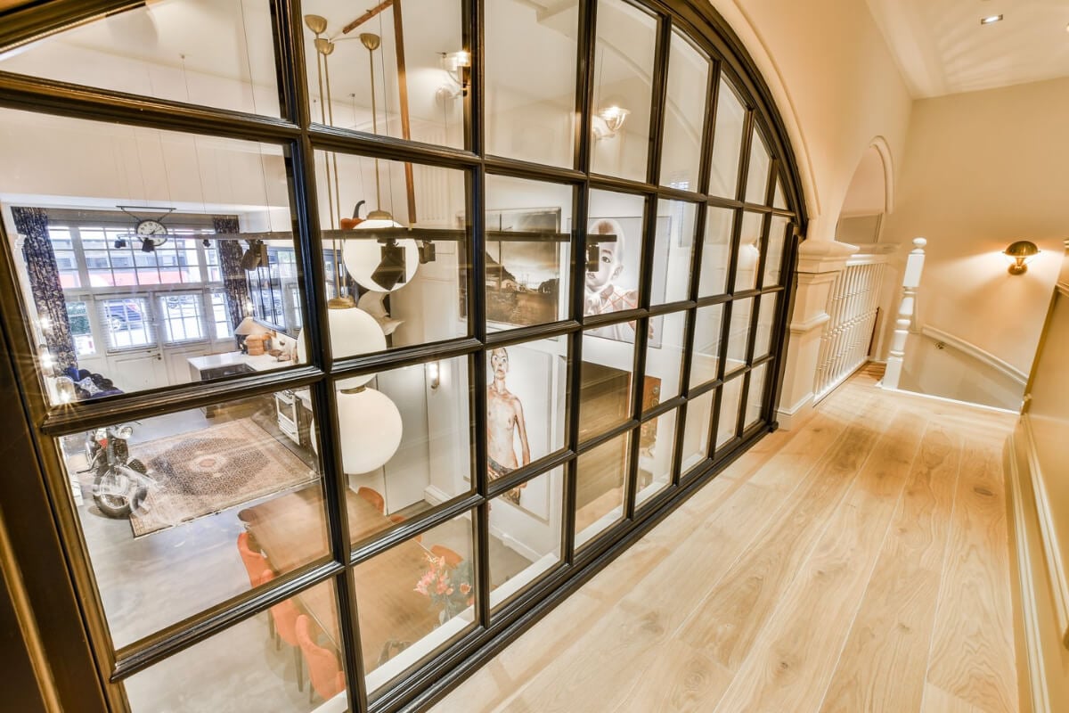 A Unique Ground Floor Duplex Apartment in Amsterdam 27 arched window looking into kitchen