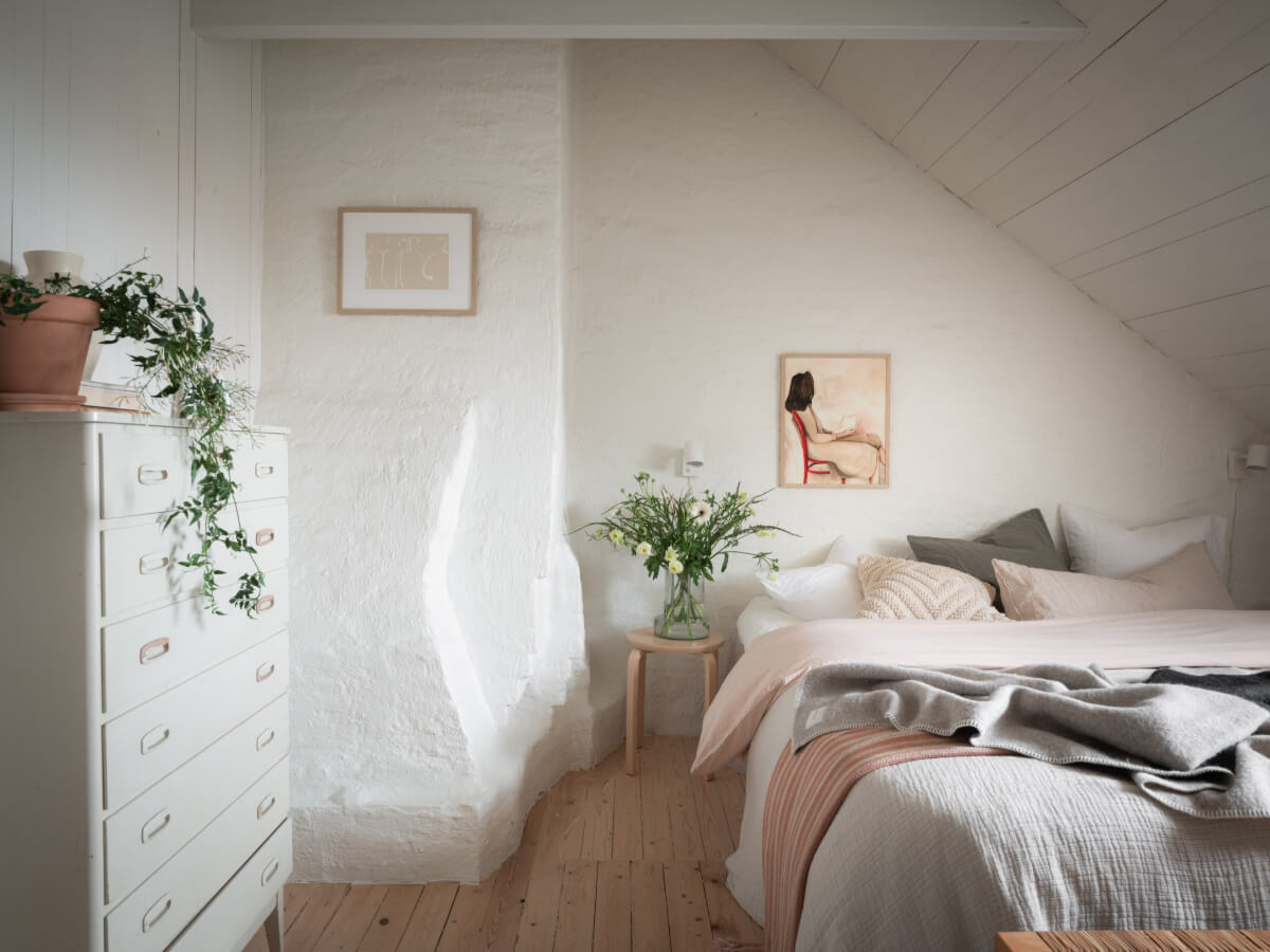 A Renovated Duplex Apartment with Exposed Brick Walls 18 attic bedroom exposed woodwork