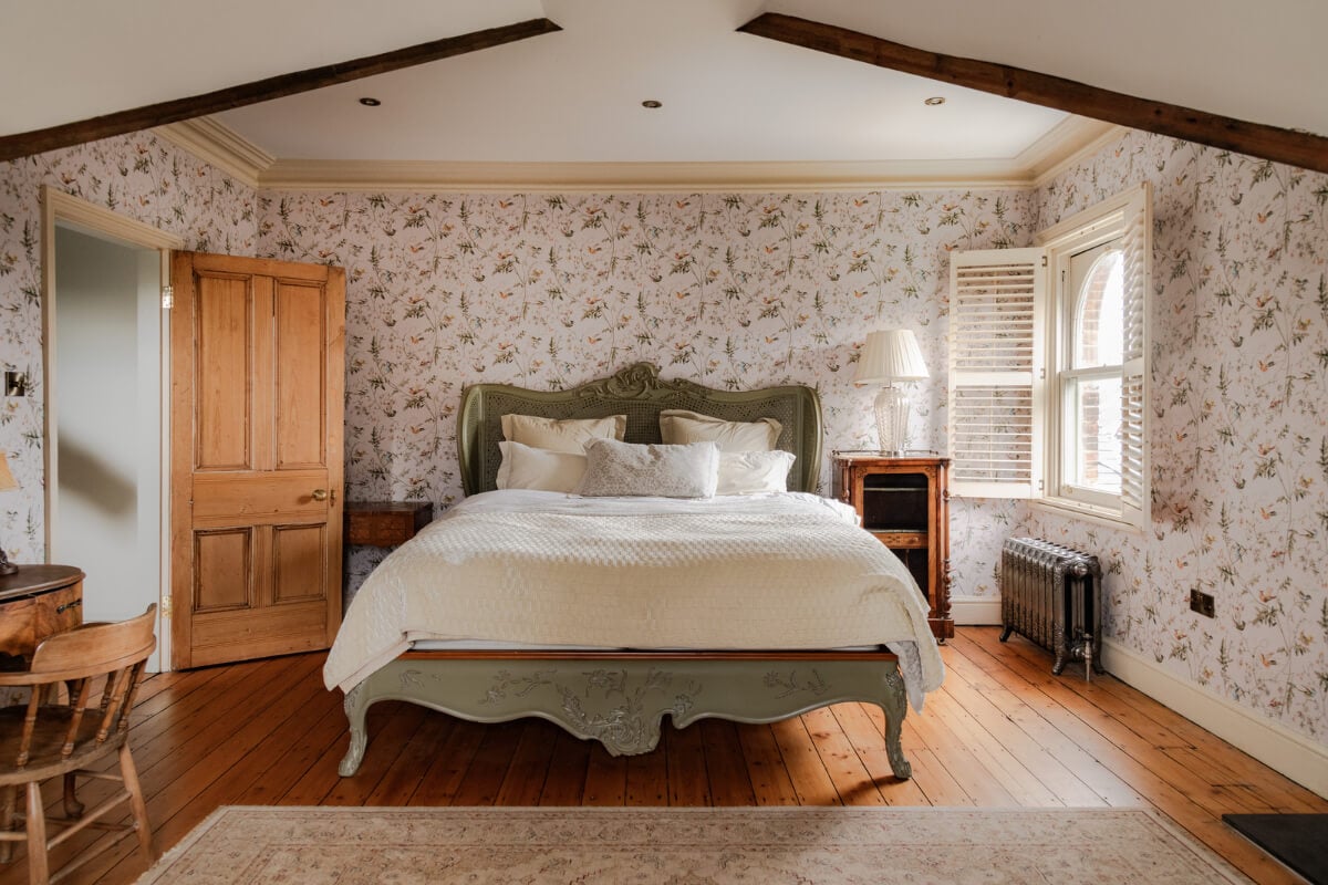 A Grand Victorian Villa in Manchester with Bold Interiors 27 attic bedroom floral wallpaper antique bed nordroom