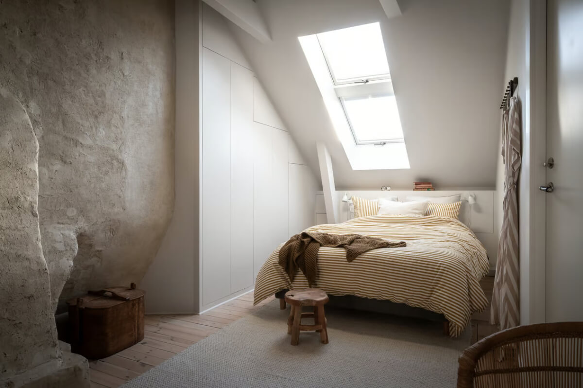 A Duplex Apartment with Period Features and a Charming Attic Bedroom 12 attic bedroom minimalistic built-in wardrobes under slanted ceiling