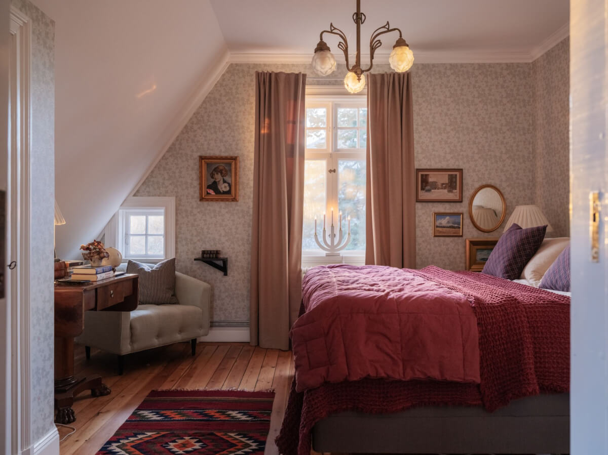 A Beautiful Turn-of-the-Century Family Home in Sweden 36 attic bedroom slanted ceiling wallpaper vintage art