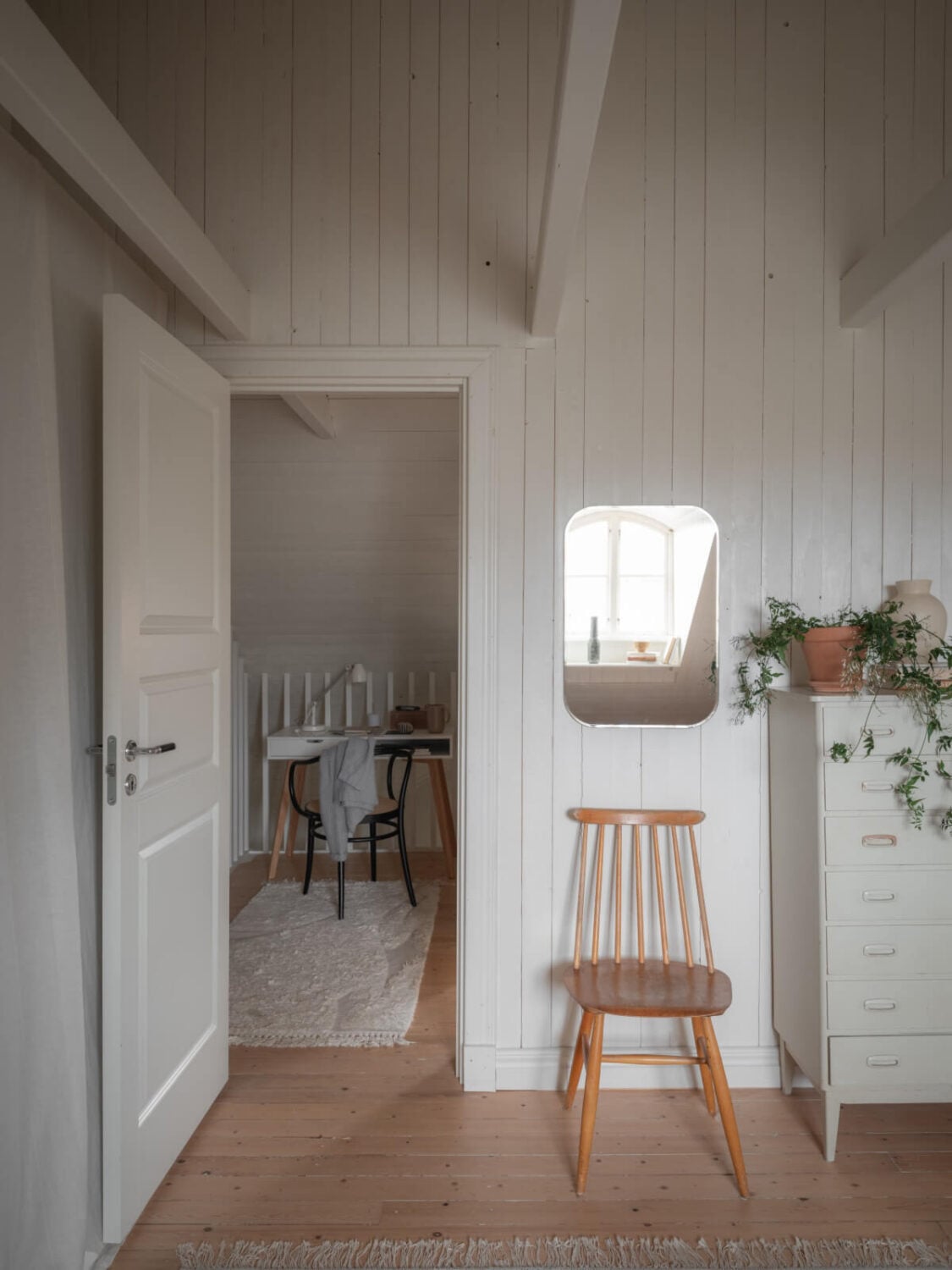 A Renovated Duplex Apartment with Exposed Brick Walls 20 attic bedroom white wooden walls