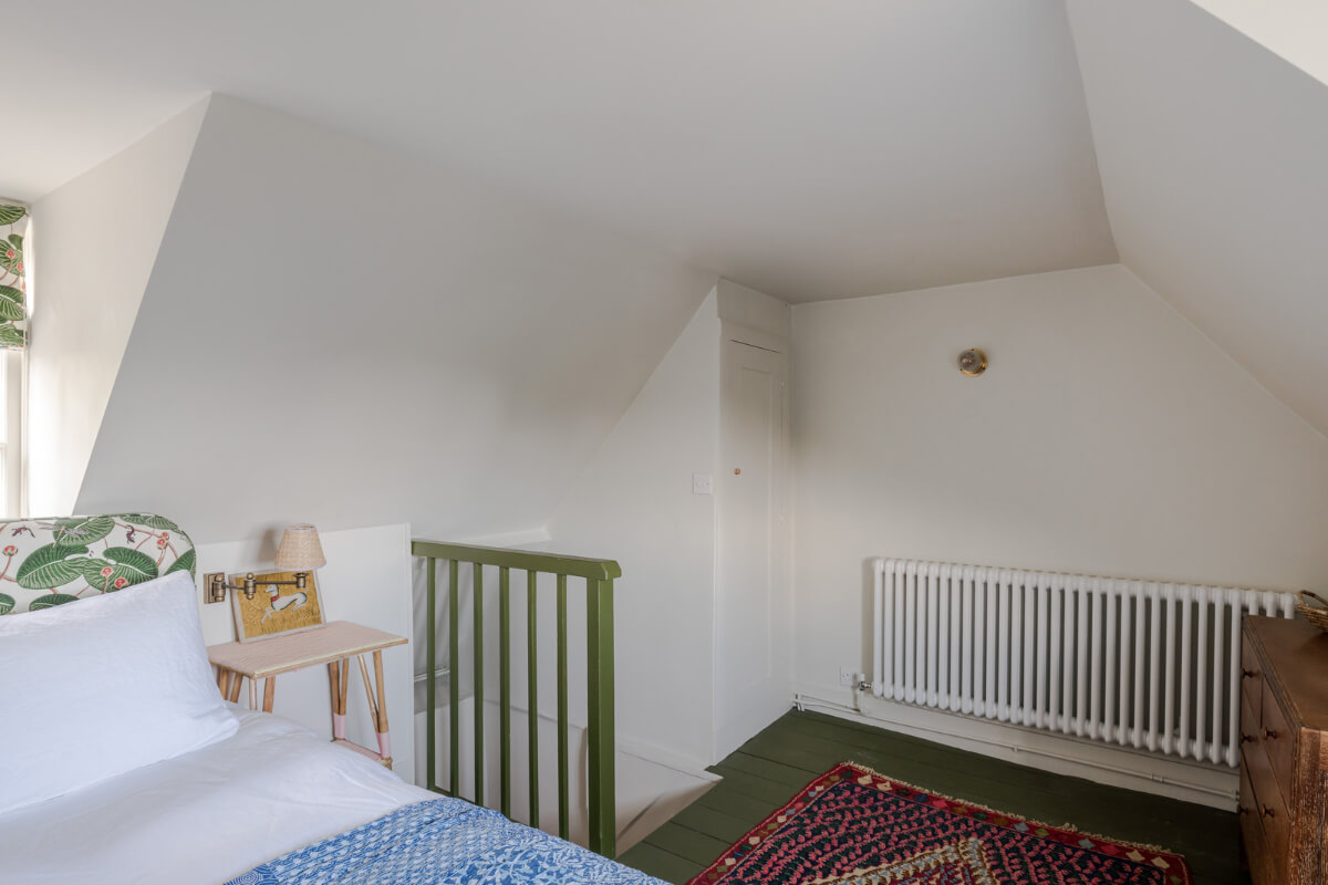 A Carefully Selected Color Palette in an 18th-Century English Cottage 16 attic bedroom with green painted floorboards