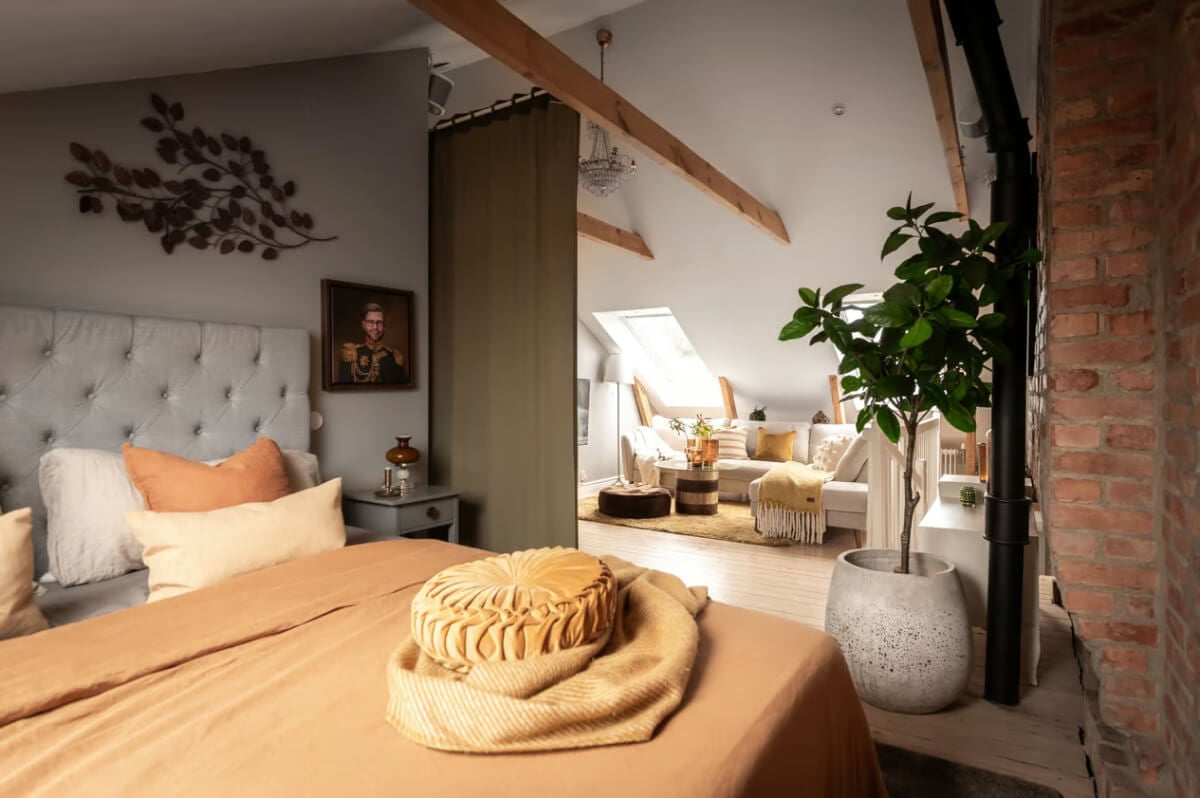 Best of 2025: Bedrooms 42 attic bedroom with sitting area and warm colored textiles
