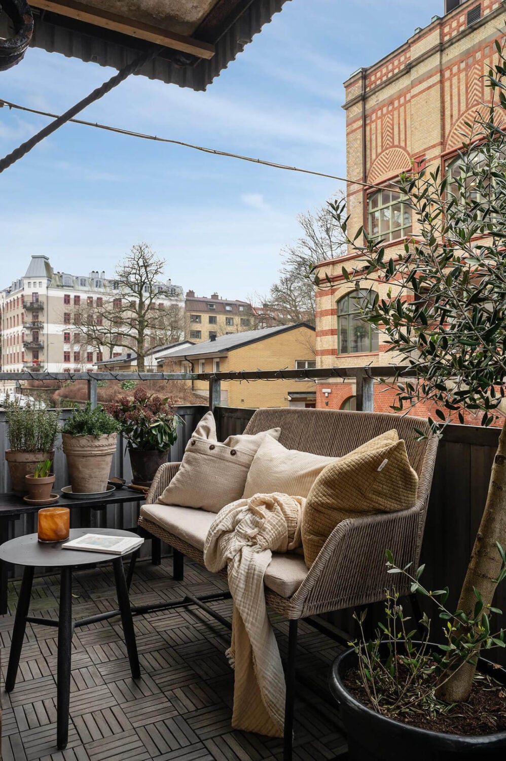 Warm and Inviting Rooms in a Renovated Swedish Apartment 4 balcony seating