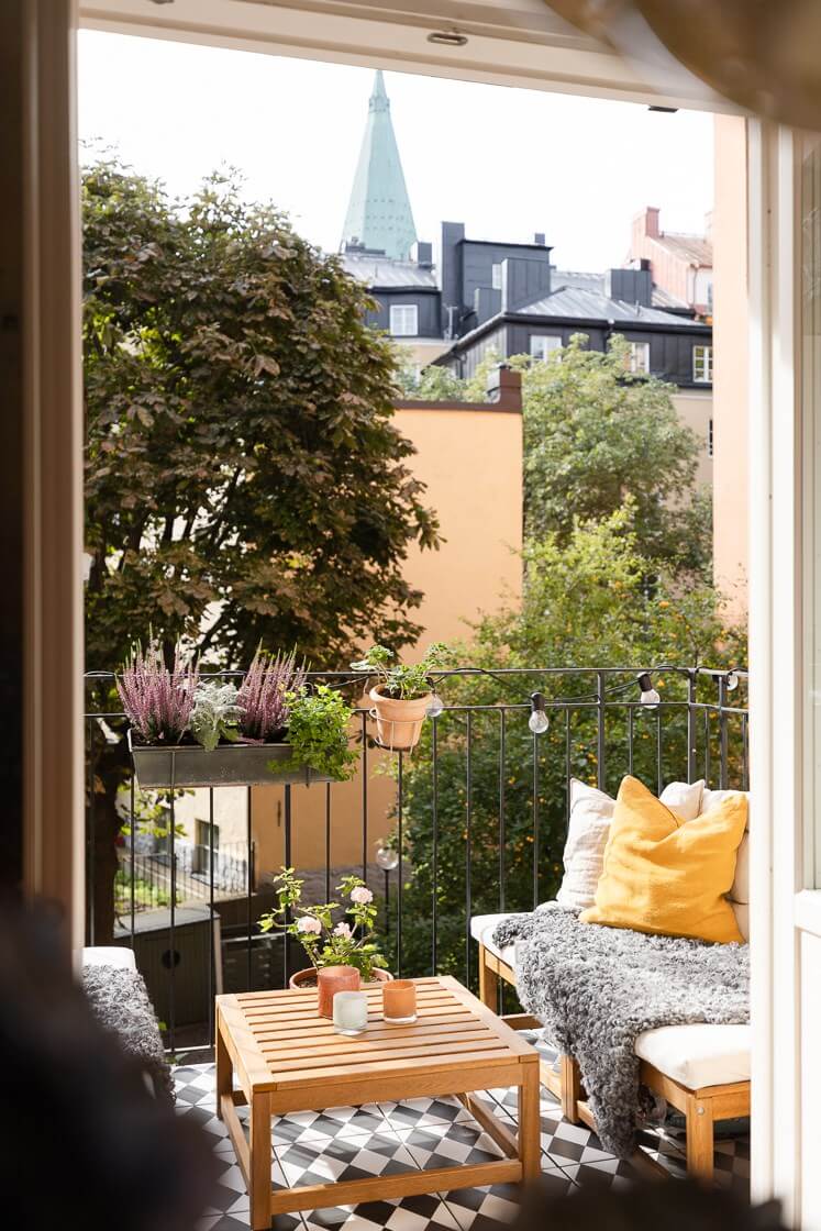 Modern Interiors in a Bright 1930s Apartment in Sweden 13 balcony with checkerboard flooring