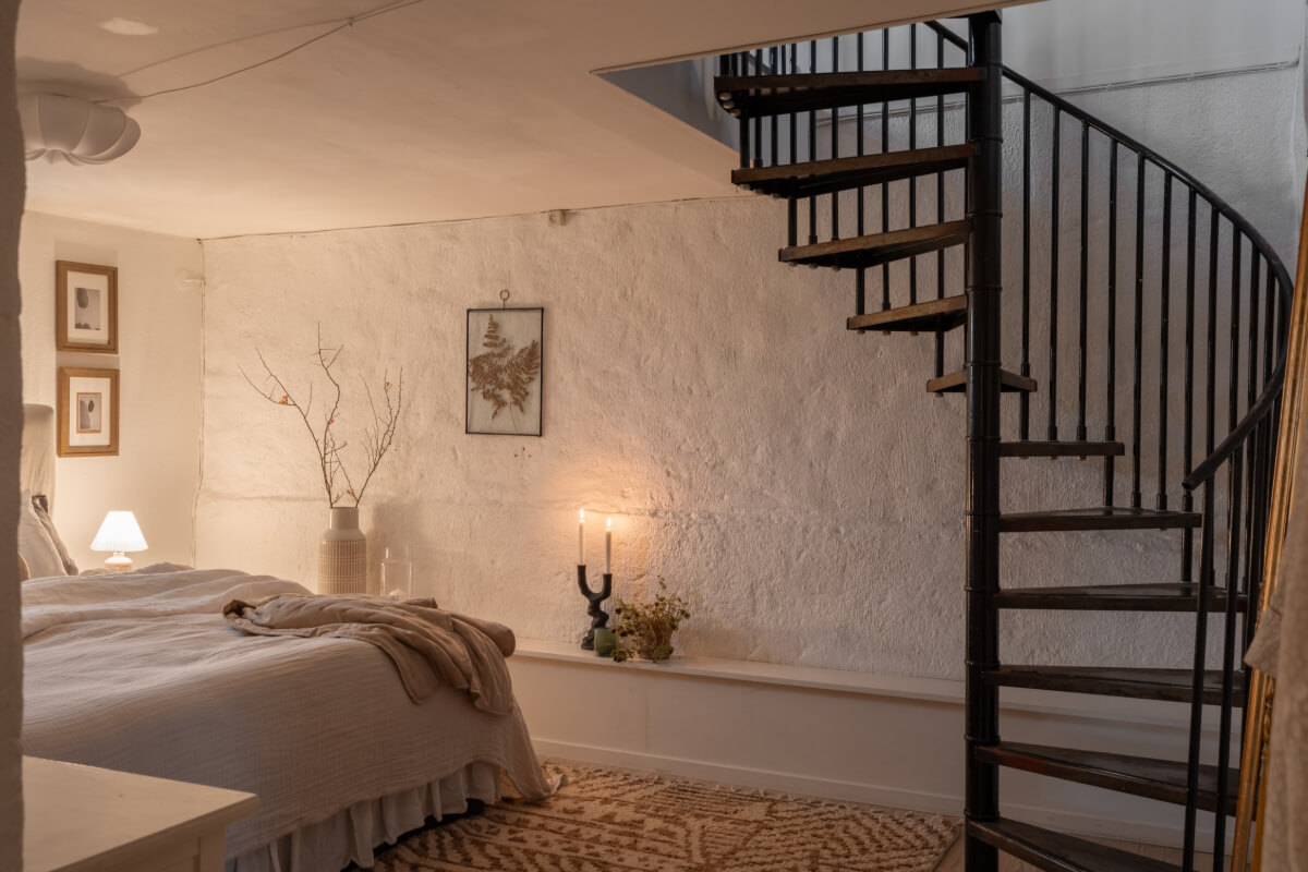 A Swedish Maisonette Apartment with Basement Bedrooms 18 basement bedroom spiral staircase