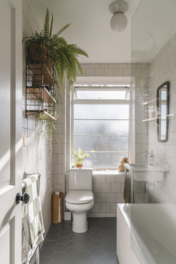 A London Apartment with a Pink and Green Kitchen 16 bathroom black hexagon floor tiles