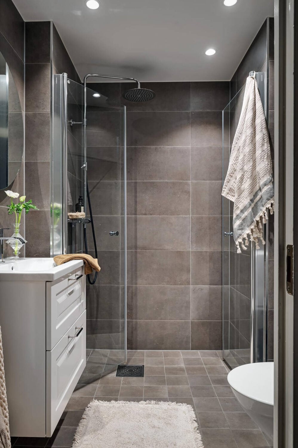 Warm and Inviting Rooms in a Renovated Swedish Apartment 27 bathroom gray-brown tiles