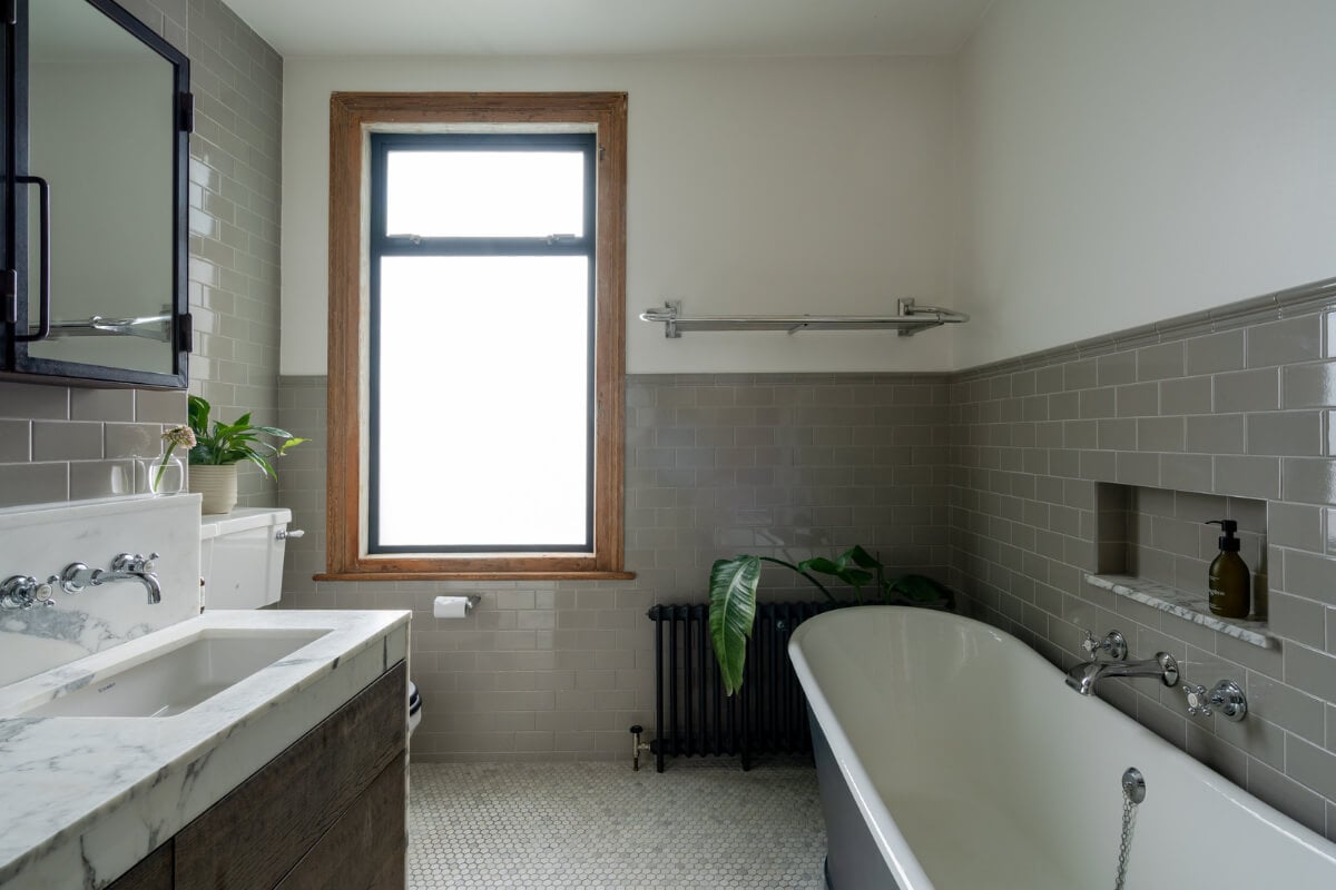 A Restored Victorian House with Exposed Brick and a Kitchen Extension 18 bathroom gray subway tiles marble sink