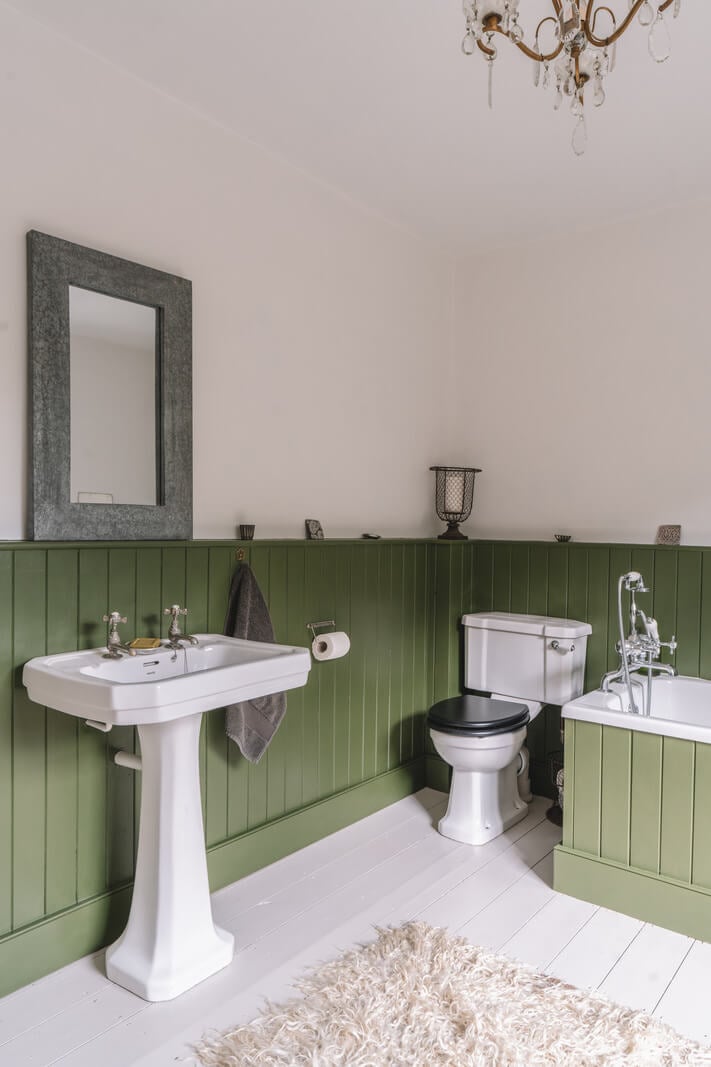 A Beautiful Renovated Country House in England 19 bathroom green paneling wooden floor