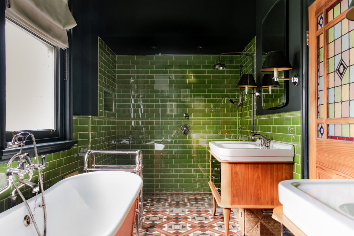 A Grand Victorian Villa in Manchester with Bold Interiors 26 bathroom green tiles orange bath nordroom