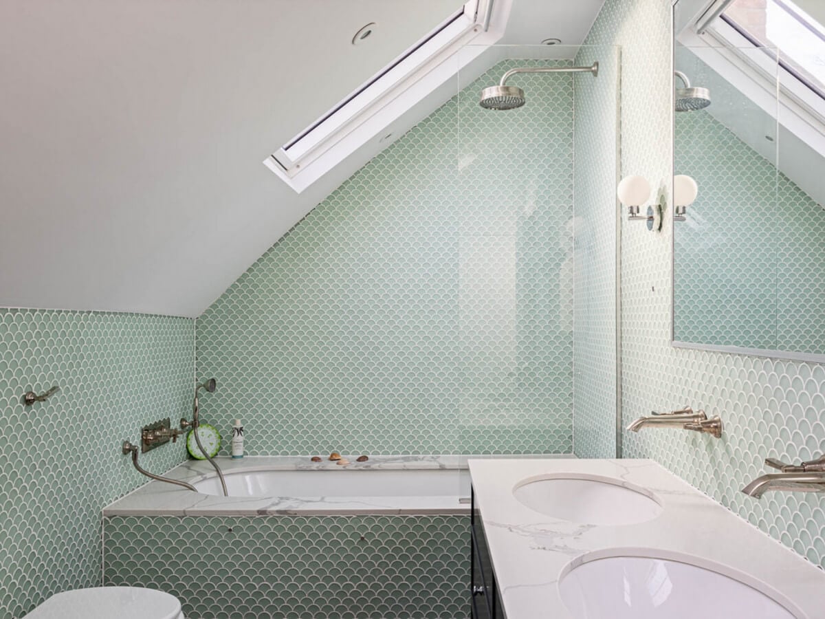An Extended Family Home in London with Pink Crittall Doors 15 bathroom green tiles slanted ceiling