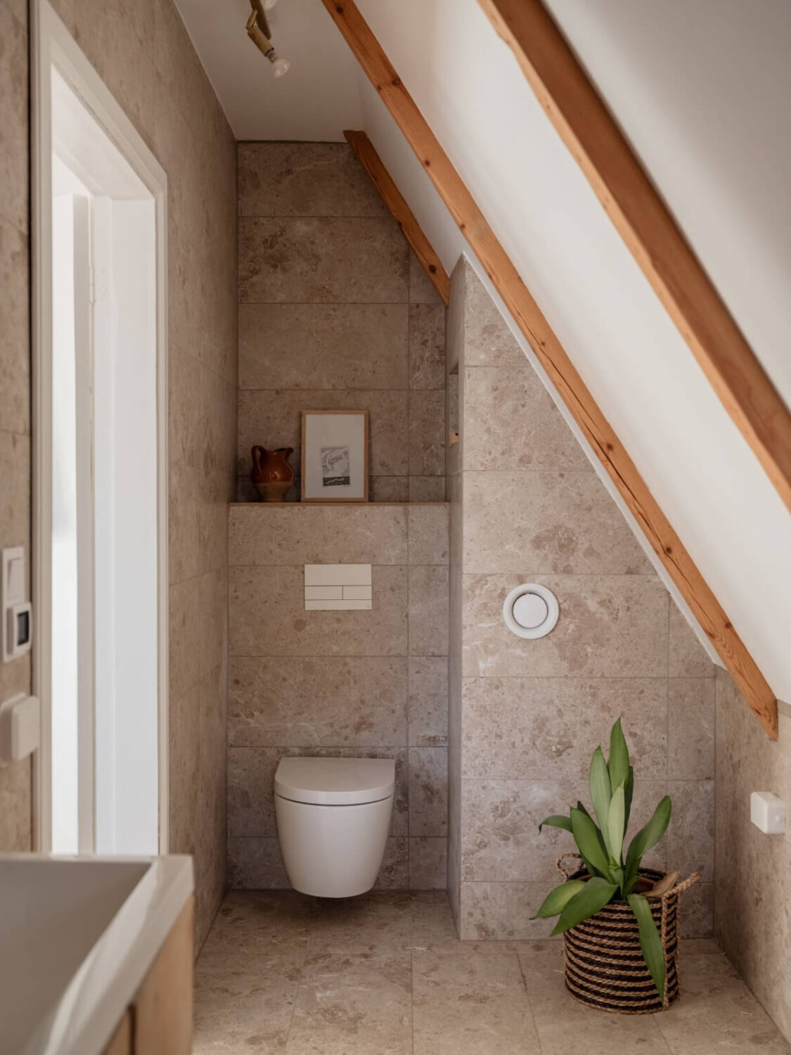 Painted Floorboards in a Unique Family Home in Sweden 24 bathroom slanted ceiling wooden beams