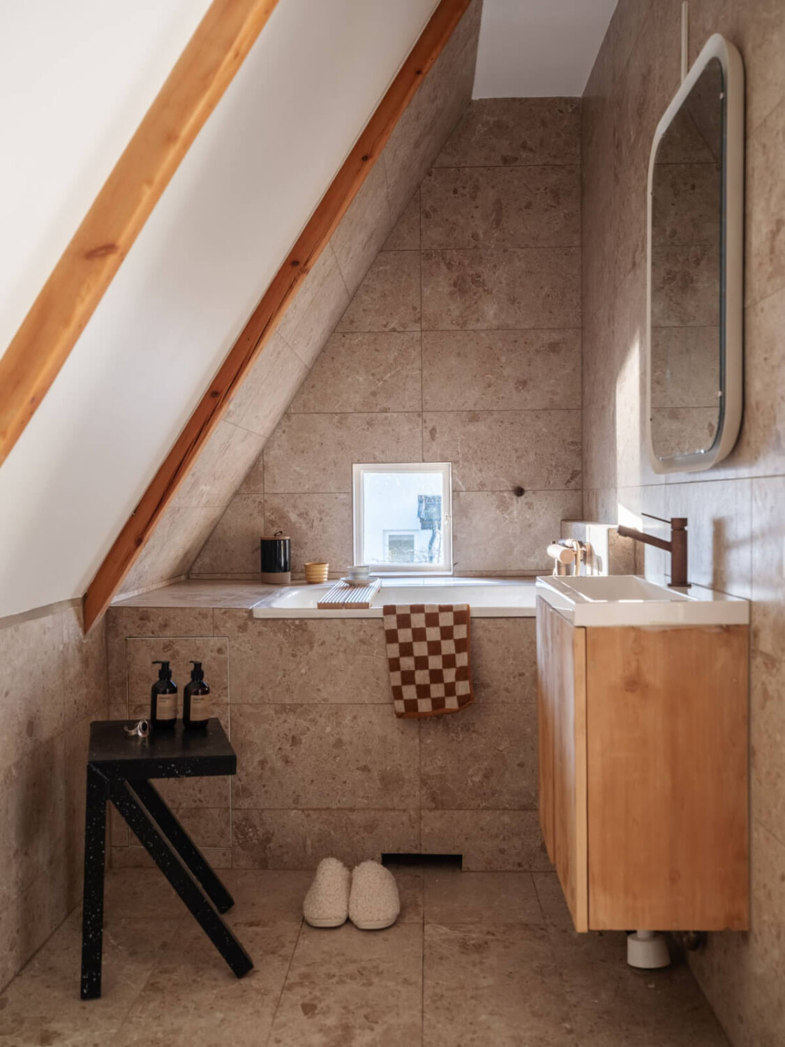Painted Floorboards in a Unique Family Home in Sweden 23 bathroom under slanted ceiling