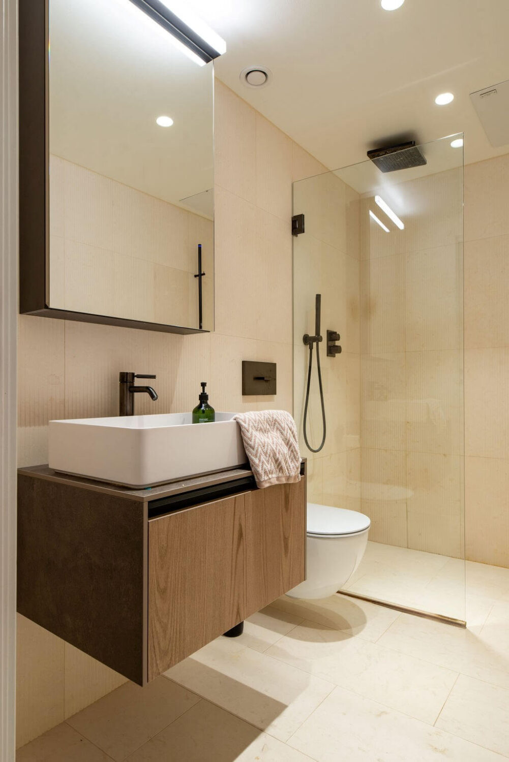 A Loft with High Ceilings and Large Windows in an Exclusive Stockholm Building 15 bathroom walk in shower textured tiles A Loft with High Ceilings and Large Windows in an Exclusive Stockholm Building