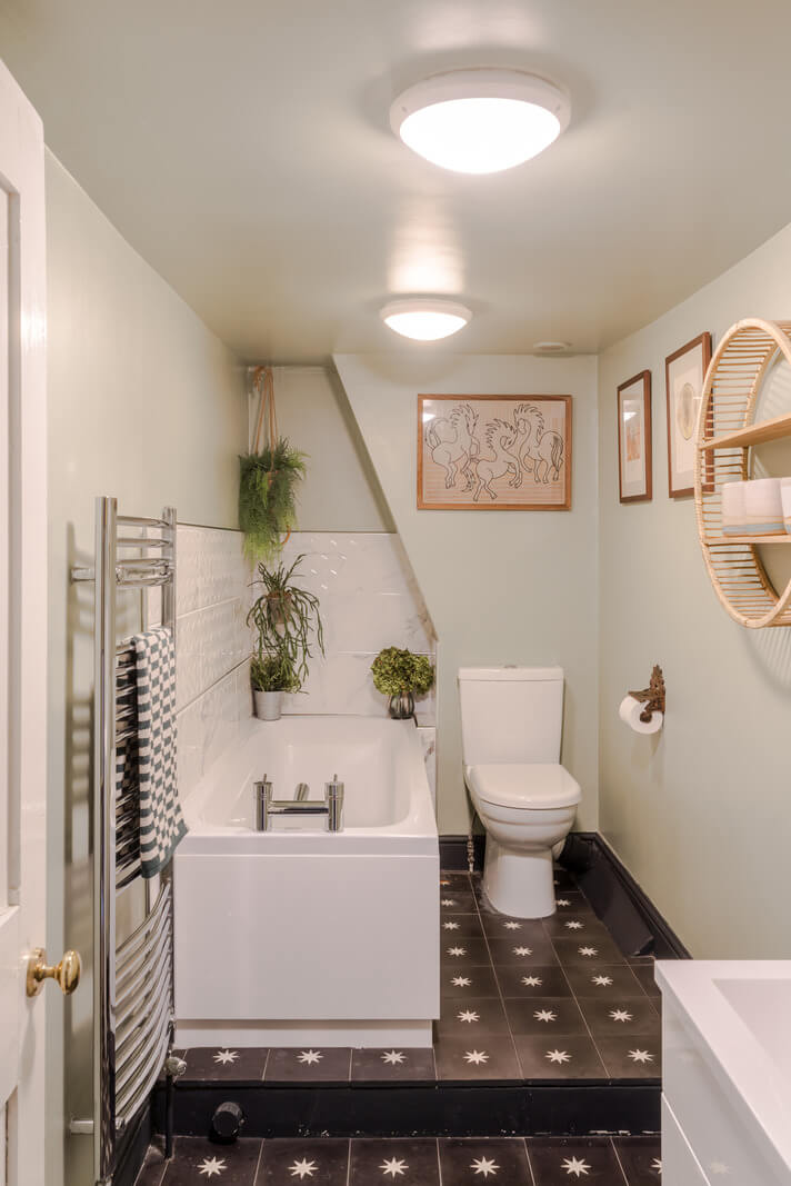 Timeworn Original Floorboards in a Regency Seaside Home 19 bathroom with black starry floor tiles