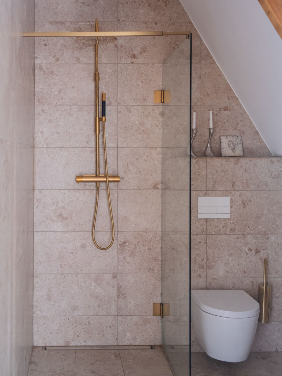 Painted Floorboards in a Unique Family Home in Sweden 28 bathroom with shower and brass fittings