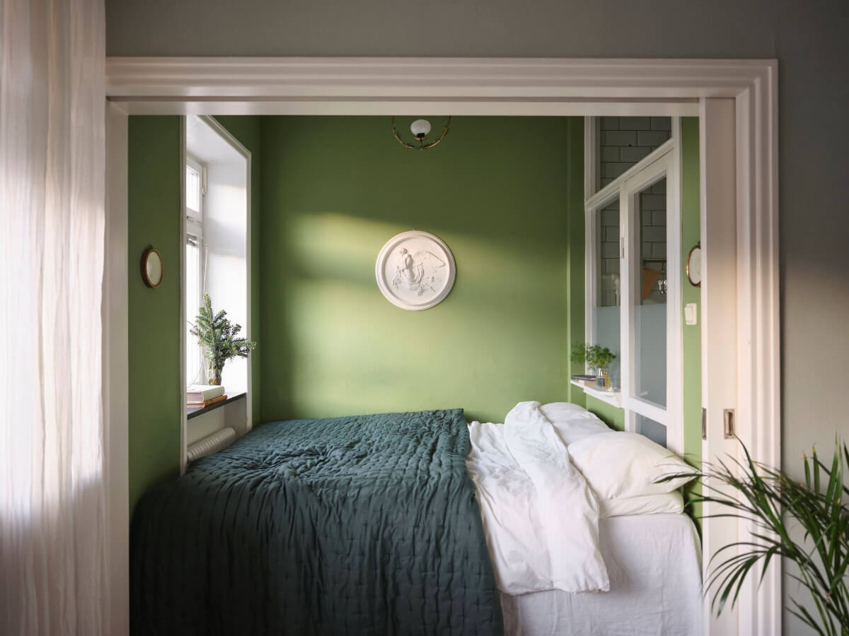 A Small Stockholm Apartment with a Tiny Green Bedroom 12 bed niche green walls