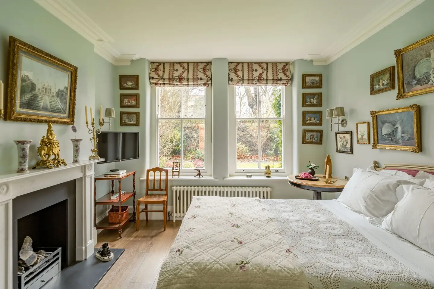 Classic Interiors and Antiques in an Art-Filled London Apartment 5 bedroom antique decor light blue walls fireplace