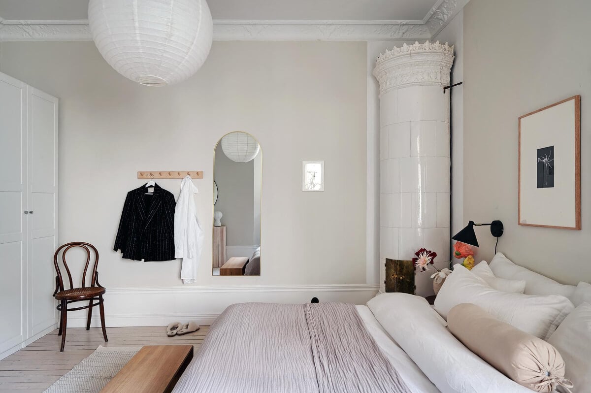 Period Features and Modern Materials in a Swedish Apartment 22 bedroom arched mirror
