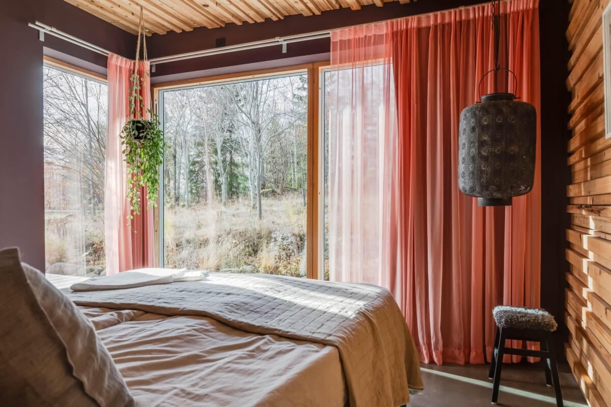 A Swedish Architectural Villa Surrounded by Nature 12 bedroom black and wooden walls pink curtains