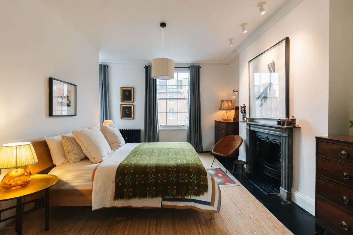 A Renovated Georgian Townhouse with a Stunning Kitchen Extension 22 bedroom black floorboards fireplace A Renovated Georgian Townhouse with a Stunning Kitchen Extension
