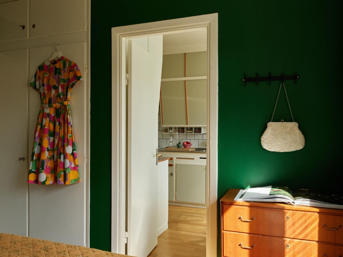 A Charming Midcentury Apartment with Original Features 17 bedroom built-in wardrobes green walls