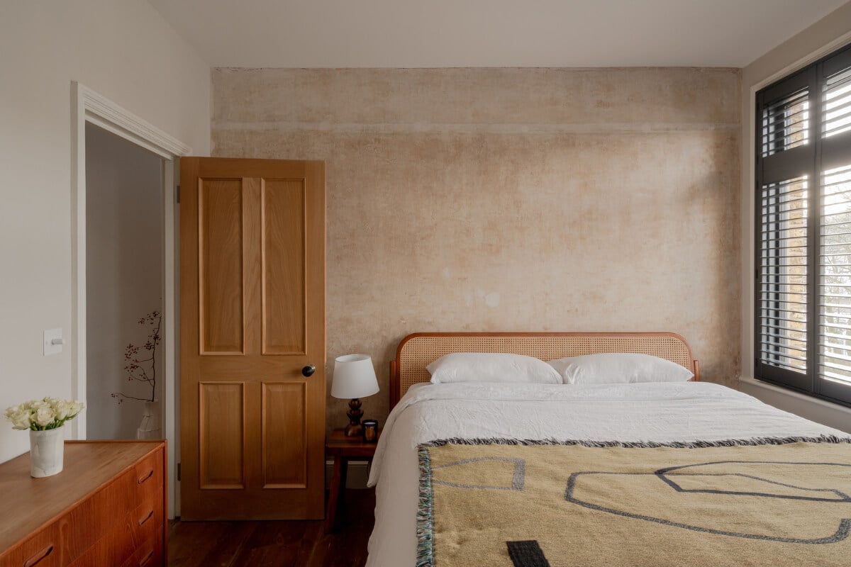 A Restored Victorian House with Exposed Brick and a Kitchen Extension 14 bedroom cane headboard raw wall