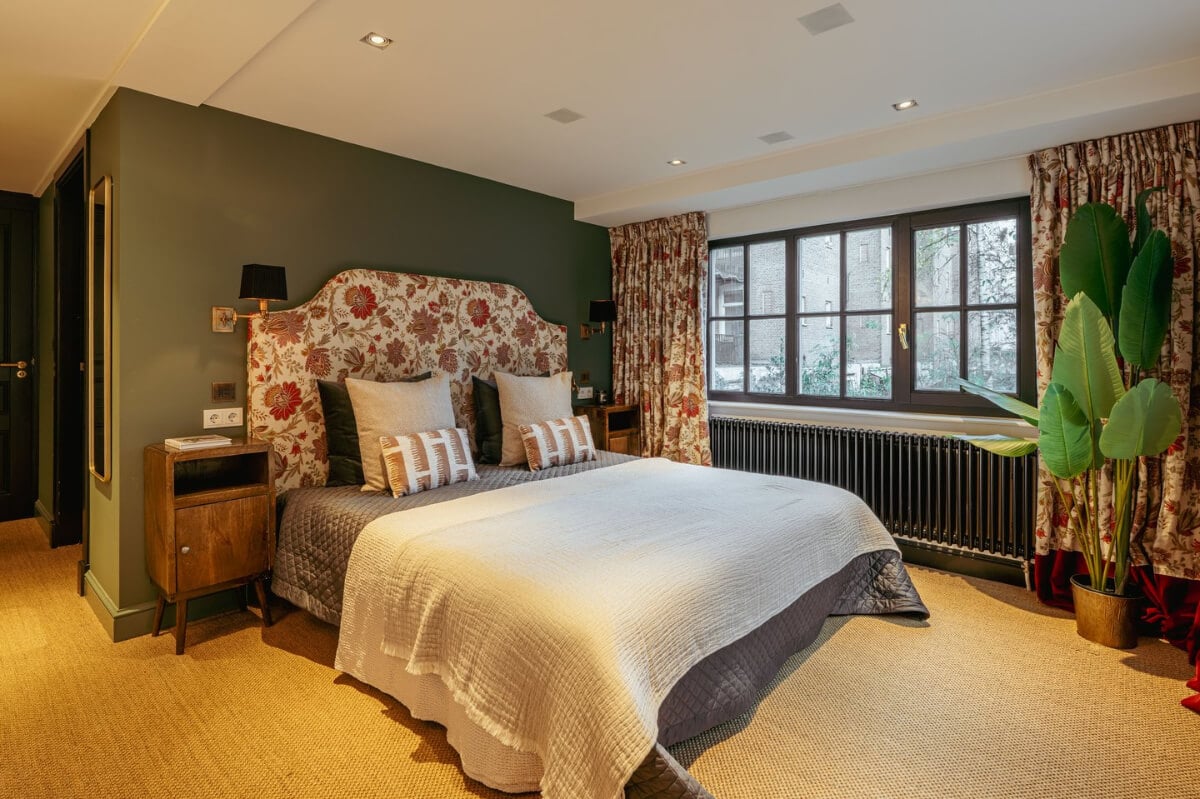 A Unique Ground Floor Duplex Apartment in Amsterdam 23 bedroom carpet floral headboard and curtains