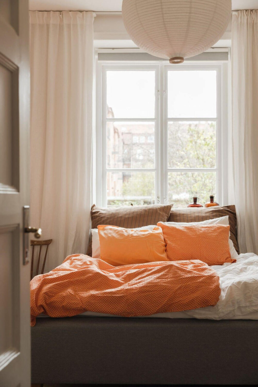 Natural Tones and Original Elements in a 1930s Apartment 11 bedroom earthy textiles