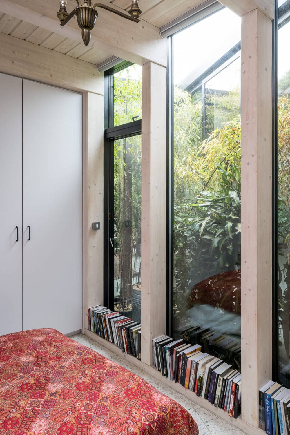 A Unique House in London with Plant-Filled Interiors and a Lush Garden 13 bedroom large windows overlooking lush garden