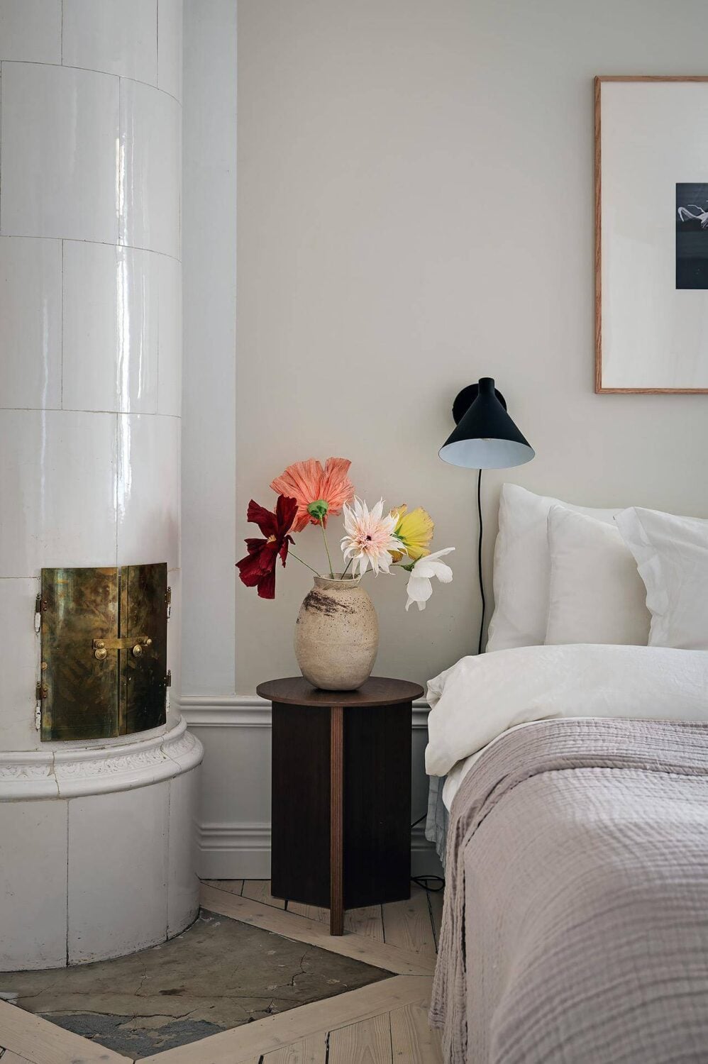 Period Features and Modern Materials in a Swedish Apartment 21 bedroom nightstand fireplace