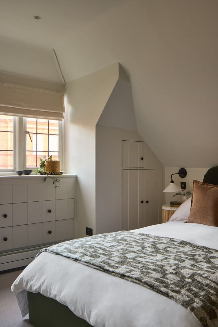 A Stunning Victorian House with Period Features and Surprising Spaces 23 bedroom slanted ceiling built-in storage space