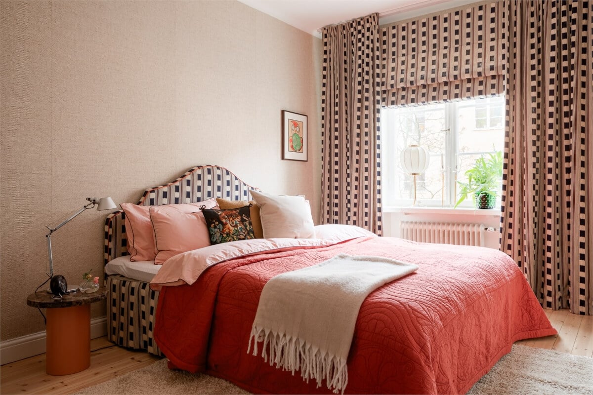 A Light-Filled Two Bedroom Apartment in Stockholm 15 bedroom wallpapered walls patterned curtains and headboard