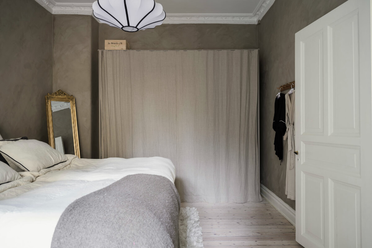 Limewash Wall and Period Features in a Swedish Apartment 18 bedroom wardrobes behind curtain