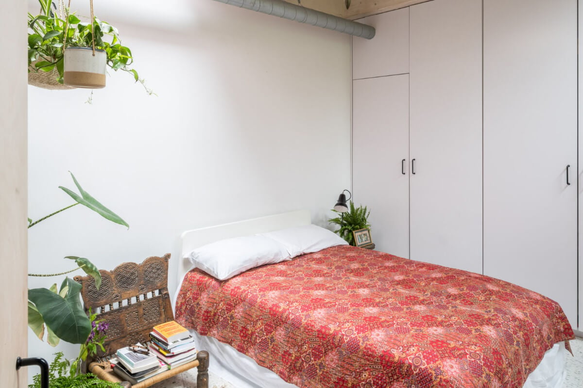 A Unique House in London with Plant-Filled Interiors and a Lush Garden 12 bedroom with plants and built-in wardrobes