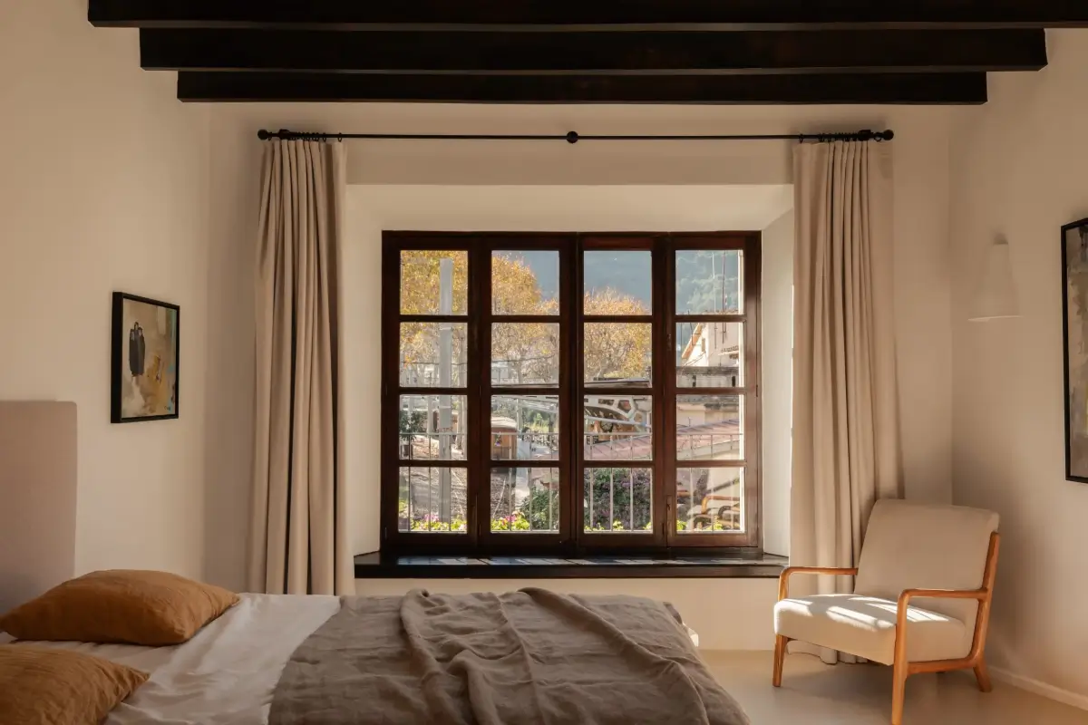 Old-World Craftsmanship and Contemporary Elegance in a Mallorcan Townhouse 7 bedroom with wooden ceiling beams