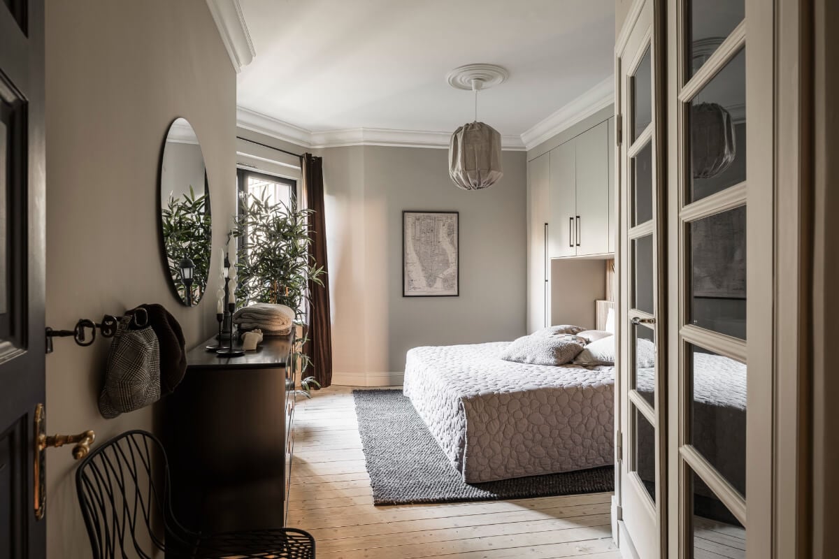 A Swedish Apartment with Exclusive Materials and Monochrome Color Scheme 17 bedroom wooden floor wardrobes around bed
