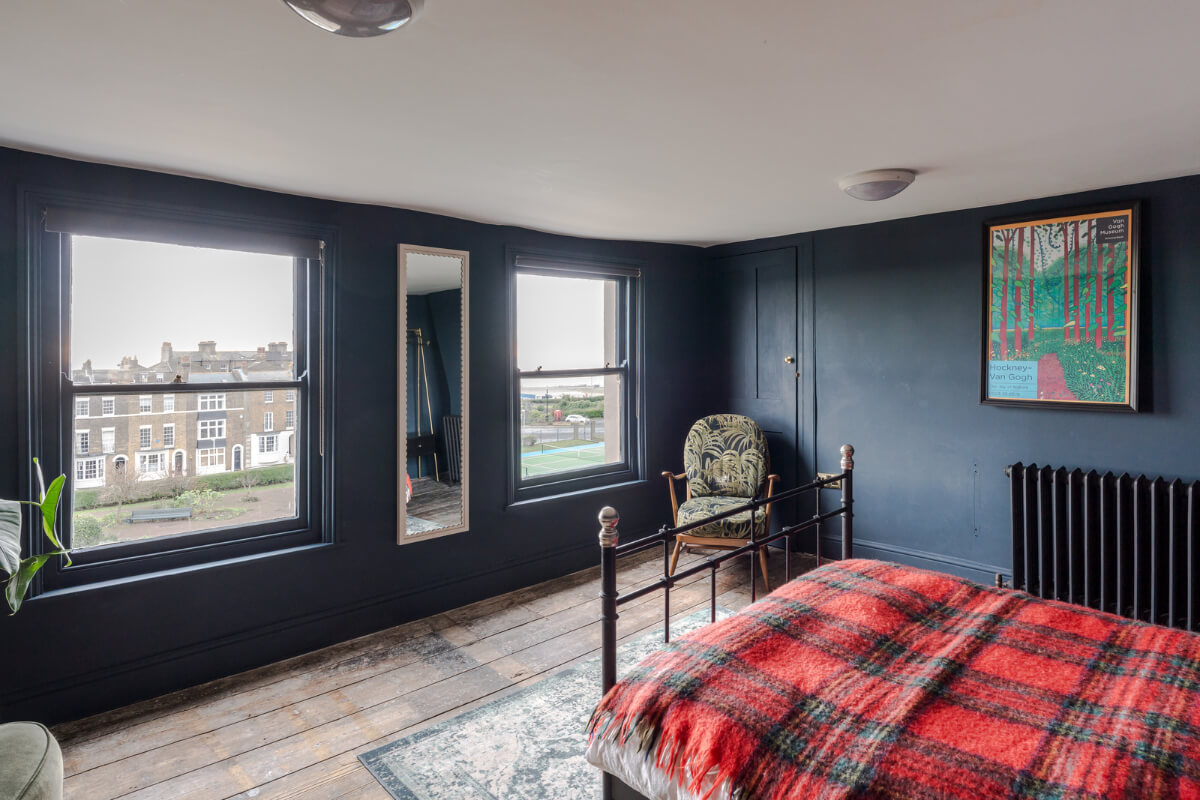 Timeworn Original Floorboards in a Regency Seaside Home 16 bedroom wooden floorboards dark blue walls large windows