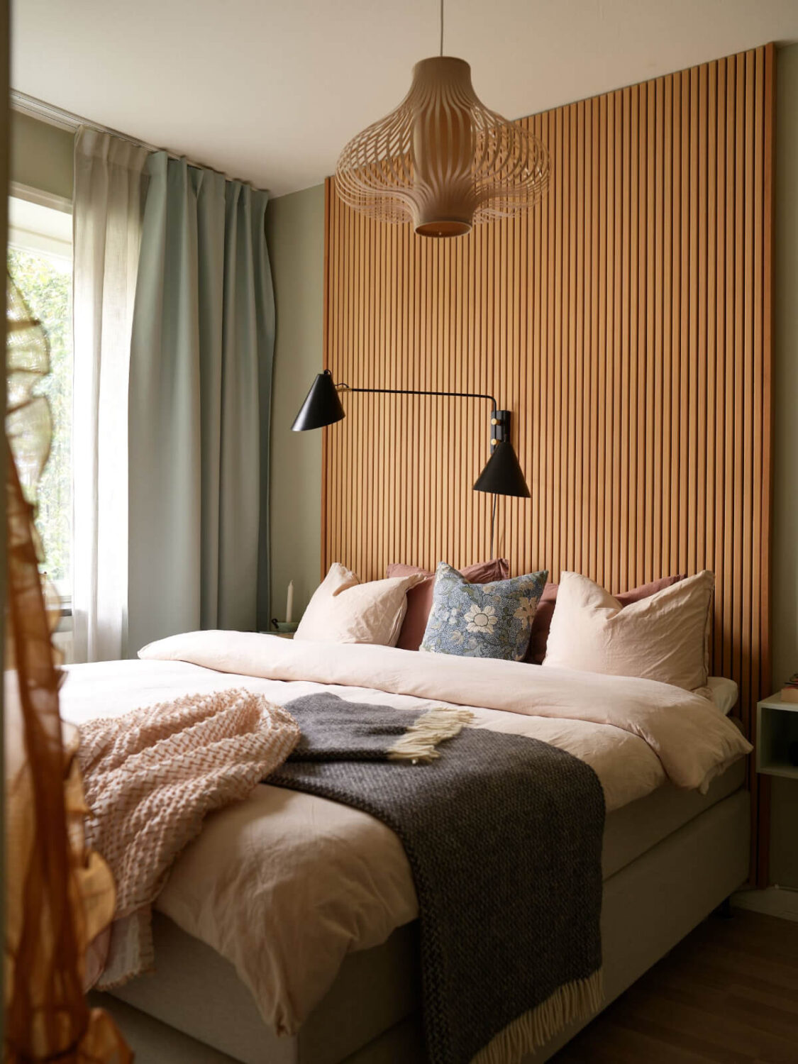 A Charming Two-Bedroom Corner Apartment in a 1940s Building 16 bedroom wooden slats feature wall