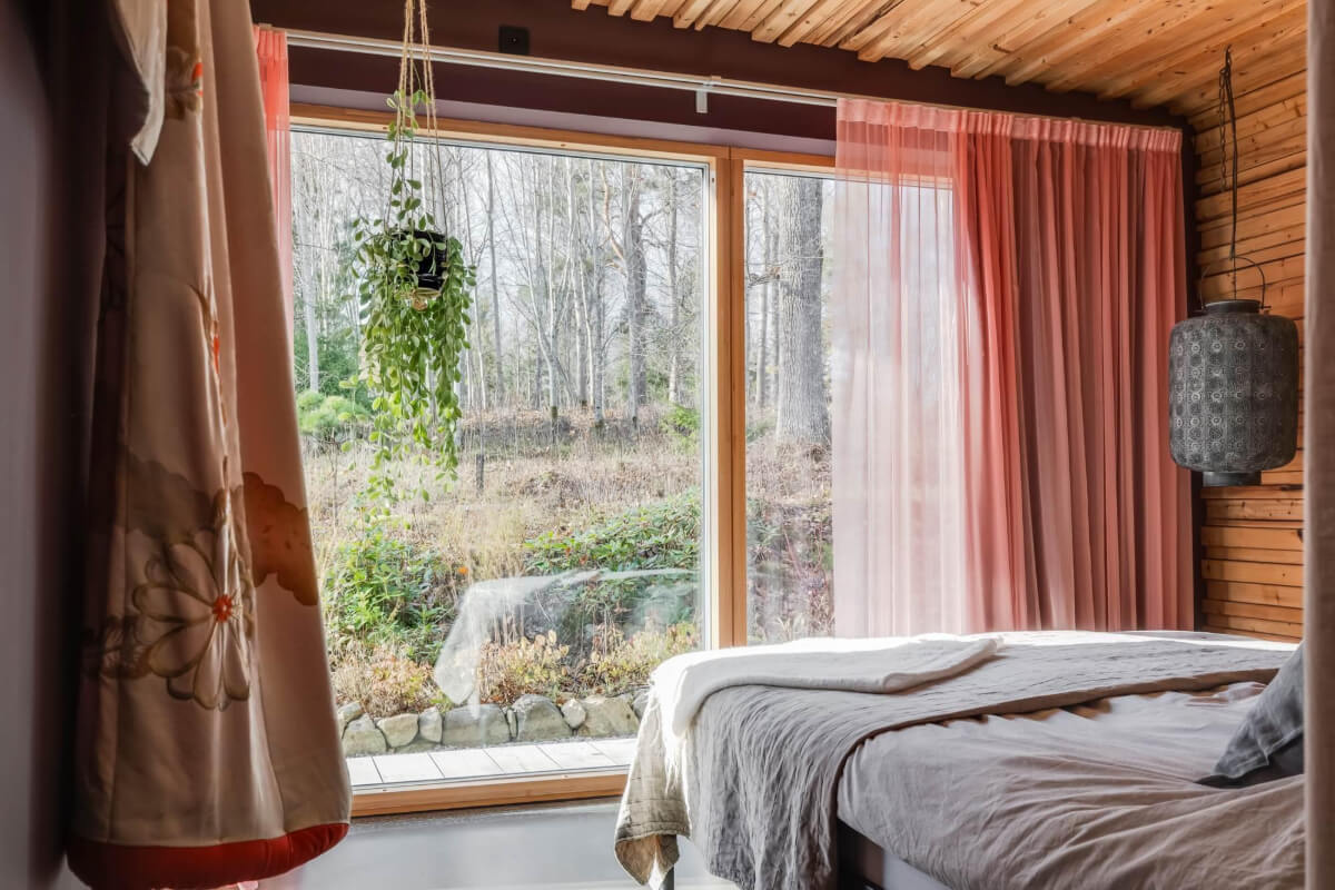 A Swedish Architectural Villa Surrounded by Nature 11 bedroom wooden walls pink curtains