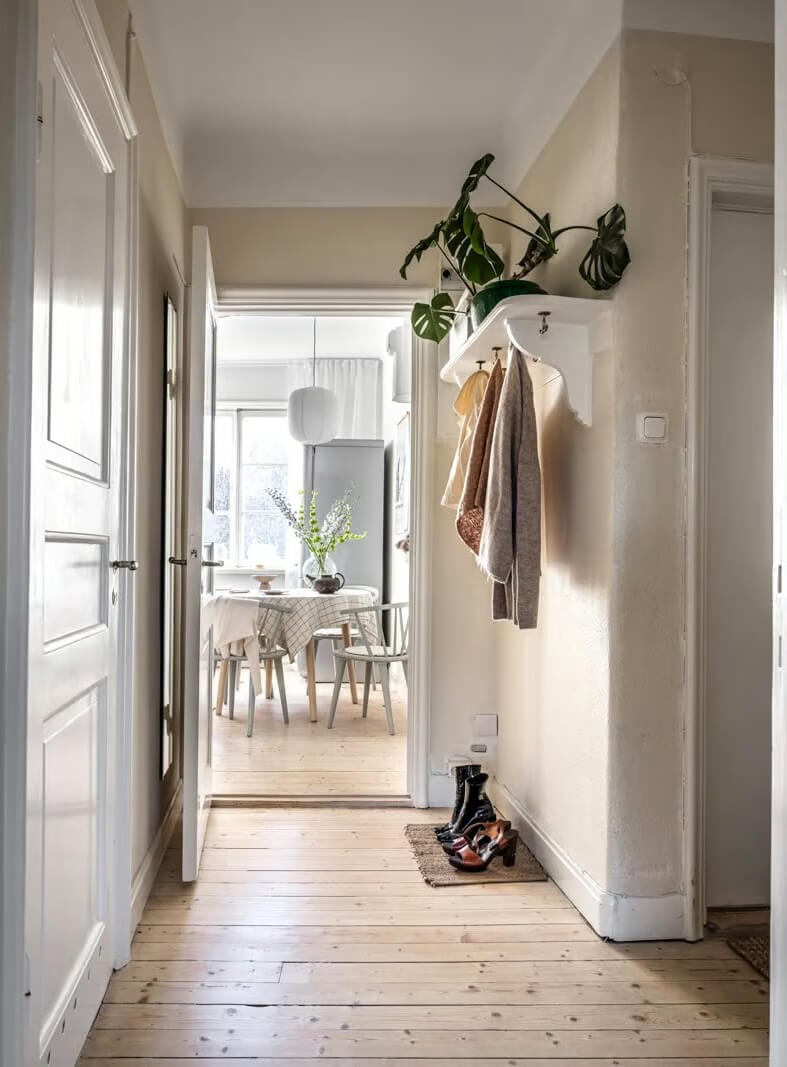 A Beige Studio Apartment with a Bright Kitchen 12 beige hallway with coat storage