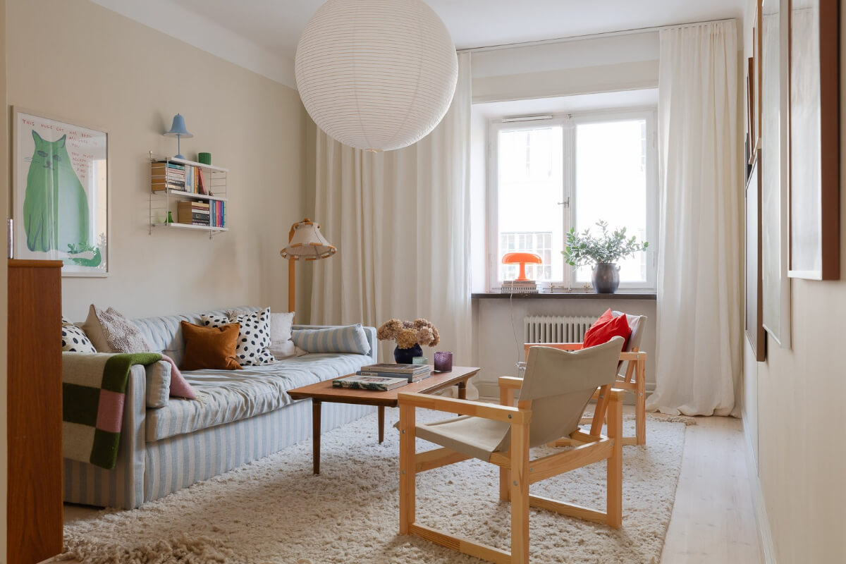 Modern Interiors in a Bright 1930s Apartment in Sweden 16 beige living room striped sofa